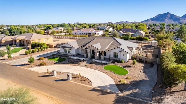 birds eye view of property featuring a mountain view