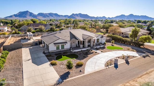 birds eye view of property with a mountain view