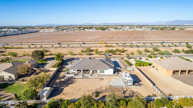 birds eye view of property with a mountain view