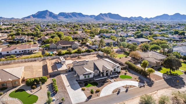 birds eye view of property with a mountain view