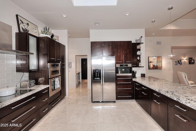 kitchen featuring wall chimney range hood, tasteful backsplash, open shelves, visible vents, and appliances with stainless steel finishes