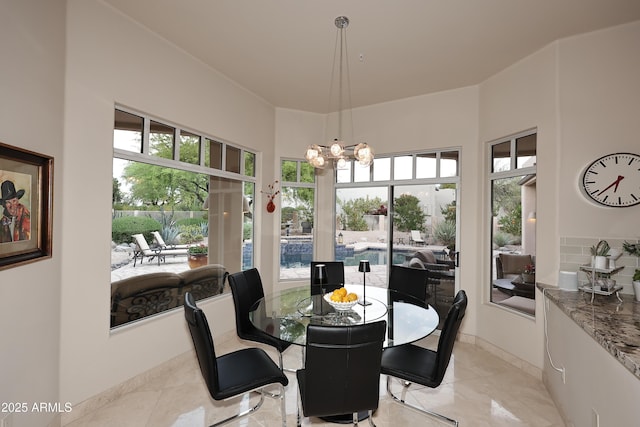 dining area featuring an inviting chandelier