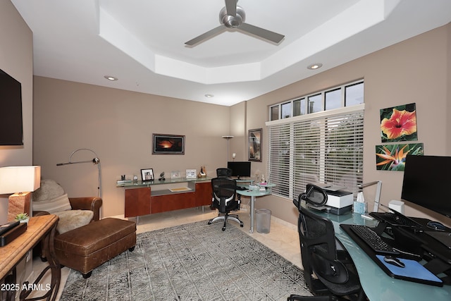 tiled office featuring a tray ceiling, a ceiling fan, and recessed lighting