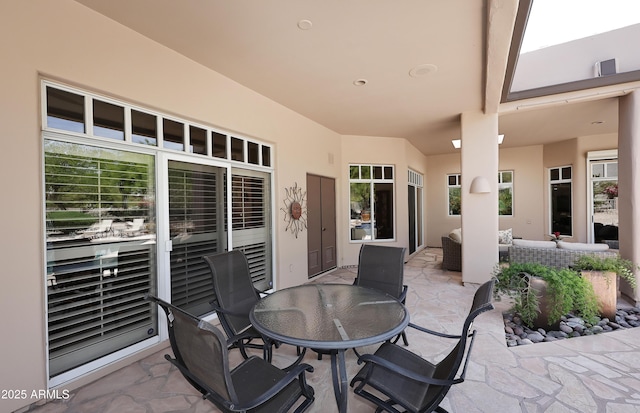 view of patio featuring an outdoor living space and outdoor dining space