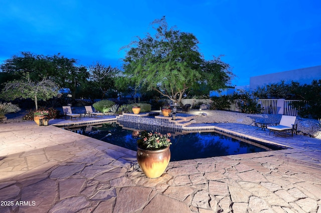 view of swimming pool with a patio, fence, and a fenced in pool