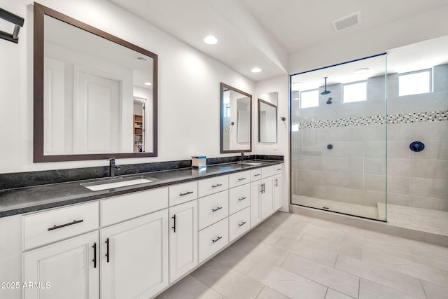 3417 E Los Gatos Dr, Phoenix, AZ 85050 - full bathroom with double vanity, a tile shower, and recessed lighting