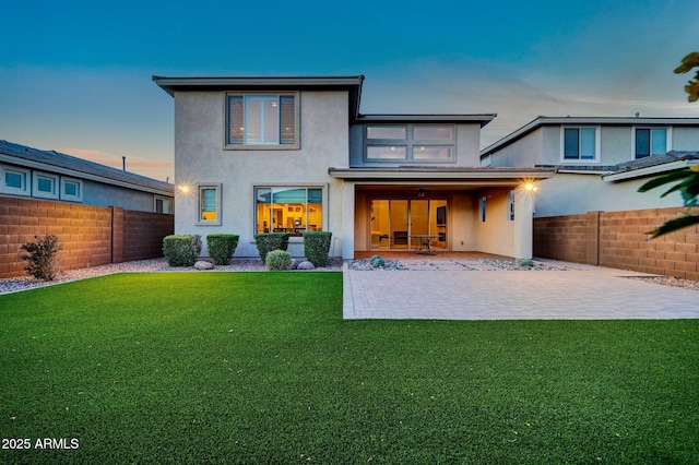 3417 E Los Gatos Dr, Phoenix, AZ 85050 - rear view of house with a fenced backyard, stucco siding, and a patio