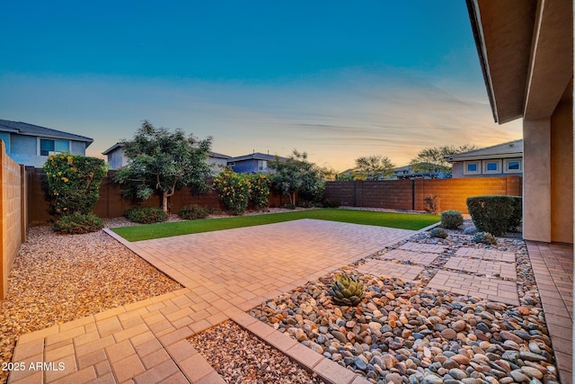 3417 E Los Gatos Dr, Phoenix, AZ 85050 - patio terrace at dusk with a patio and a fenced backyard