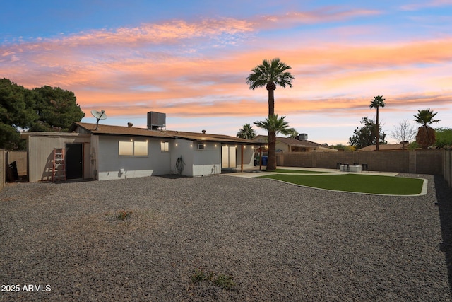 653 W Inglewood St, Mesa, AZ 85201 - rear view of property with a fenced backyard, central air condition unit, and a patio area