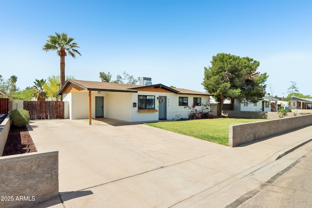 653 W Inglewood St, Mesa, AZ 85201 - ranch-style home featuring concrete driveway, fence, and a front lawn
