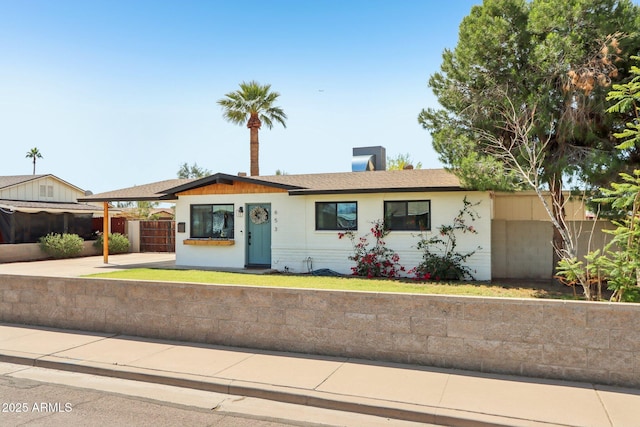 653 W Inglewood St, Mesa, AZ 85201 - ranch-style home featuring fence and a front yard