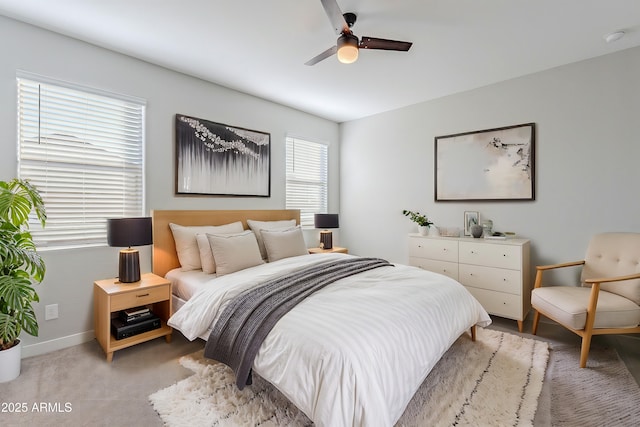 bedroom featuring ceiling fan and light colored carpet