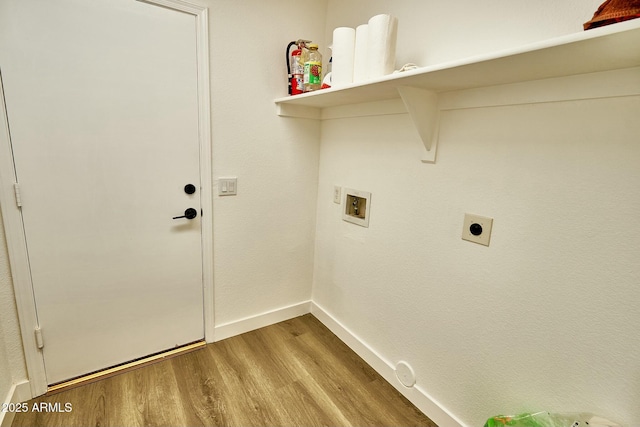 laundry area featuring hookup for a washing machine, light wood-style floors, electric dryer hookup, laundry area, and baseboards