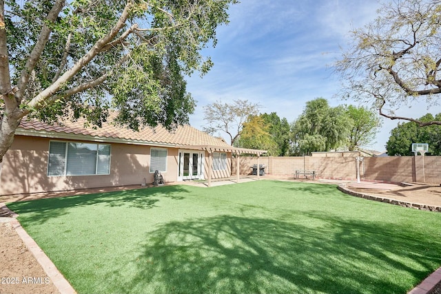 view of yard featuring a patio, french doors, a fenced backyard, and a pergola