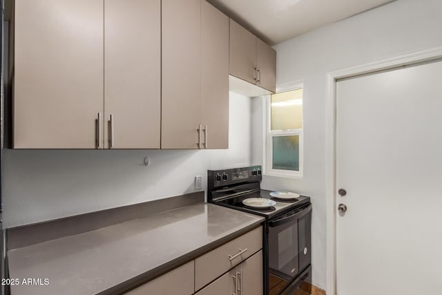 1605 W Osborn Rd, Phoenix, AZ 85015 - kitchen featuring black electric range, dark countertops, and gray cabinetry