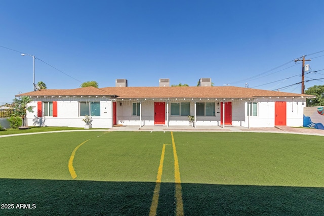 1605 W Osborn Rd, Phoenix, AZ 85015 - ranch-style home featuring a putting area, a front yard, and a chimney