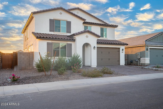 mediterranean / spanish-style house featuring a garage