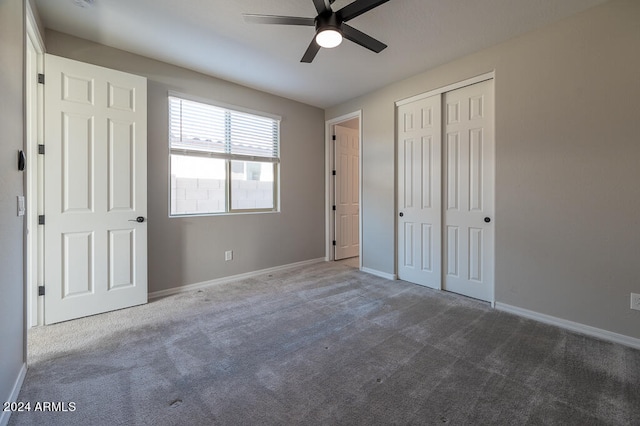 unfurnished bedroom with a closet, ceiling fan, and carpet