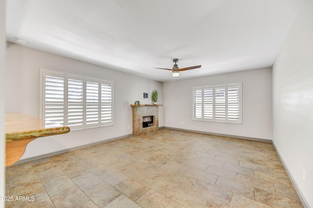 37801 N Cave Creek Rd Unit 13, Cave Creek, AZ 85331 - unfurnished living room featuring a ceiling fan and a fireplace