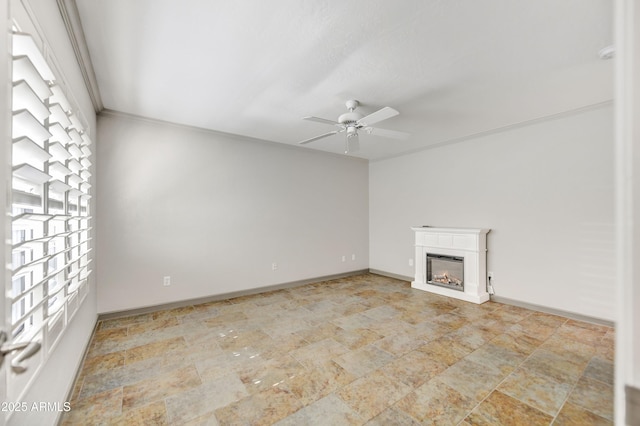 37801 N Cave Creek Rd Unit 13, Cave Creek, AZ 85331 - unfurnished living room with ceiling fan, a glass covered fireplace, and stone finish floors
