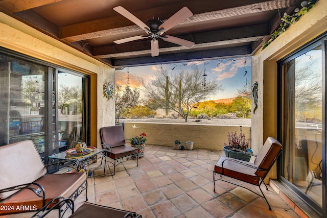 37801 N Cave Creek Rd Unit 13, Cave Creek, AZ 85331 - sunroom / solarium featuring a ceiling fan and beamed ceiling