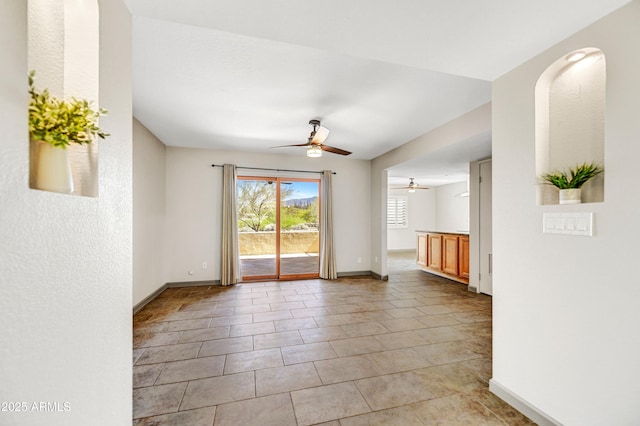 37801 N Cave Creek Rd Unit 13, Cave Creek, AZ 85331 - empty room with a ceiling fan and light tile patterned floors