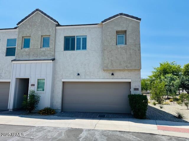 8330 N 22nd Ln, Phoenix, AZ 85021 - view of front of home with an attached garage and stucco siding