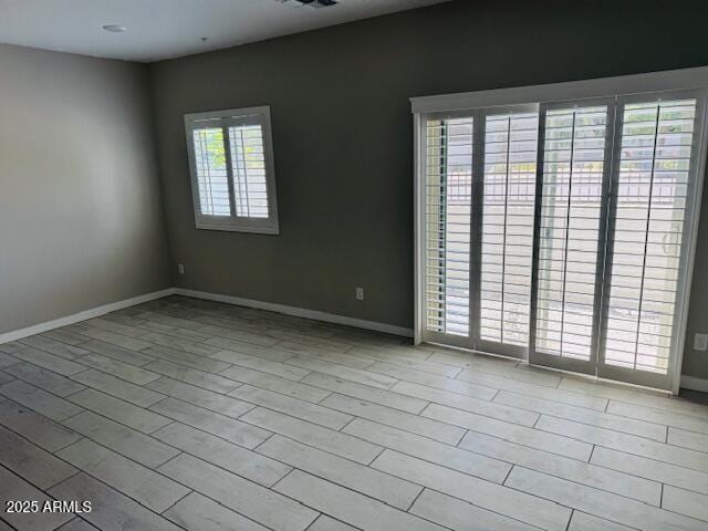 8330 N 22nd Ln, Phoenix, AZ 85021 - spare room featuring wood finished floors