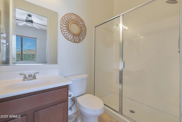 bathroom with toilet, walk in shower, vanity, and ceiling fan