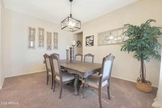 carpeted dining room with a notable chandelier