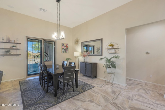 dining area with a notable chandelier