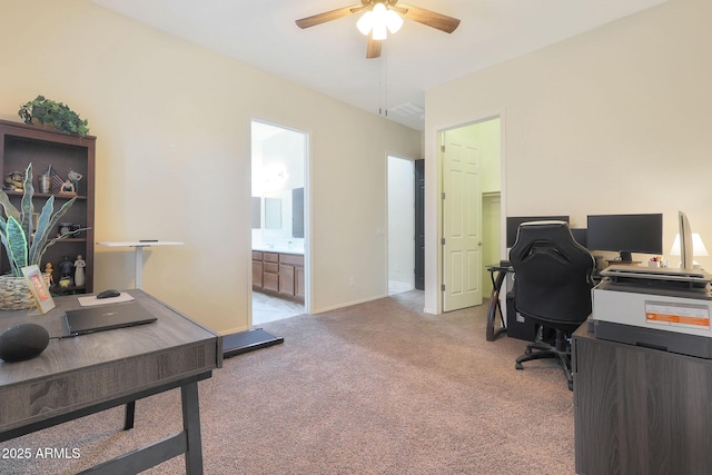 carpeted office space with ceiling fan