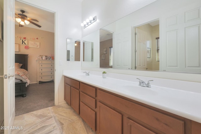 bathroom featuring ceiling fan and vanity