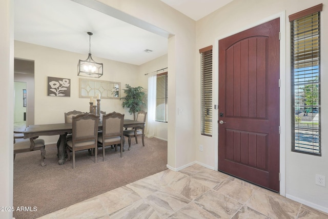 view of carpeted entrance foyer