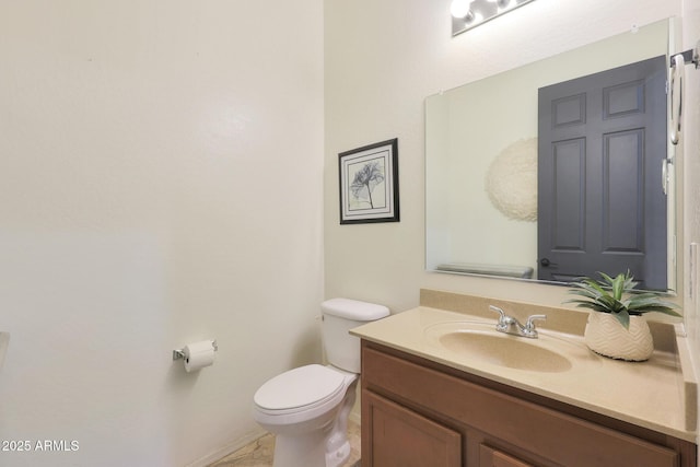 bathroom with toilet and vanity