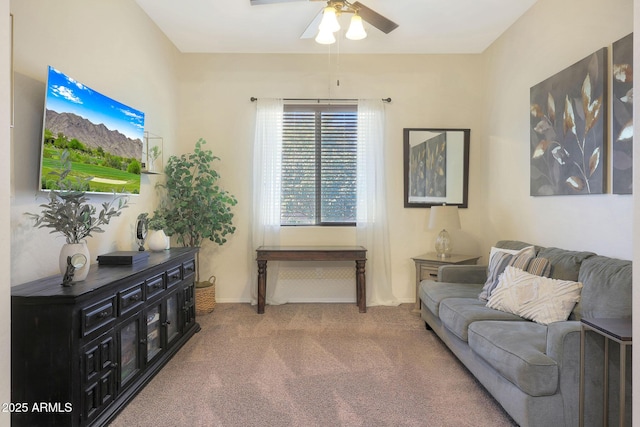 carpeted living room with ceiling fan