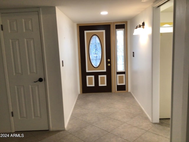 entryway featuring light tile patterned floors