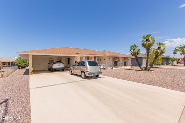 single story home featuring a carport