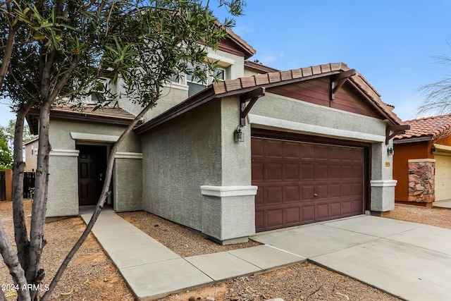 view of side of home with a garage