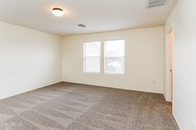 empty room featuring carpet floors