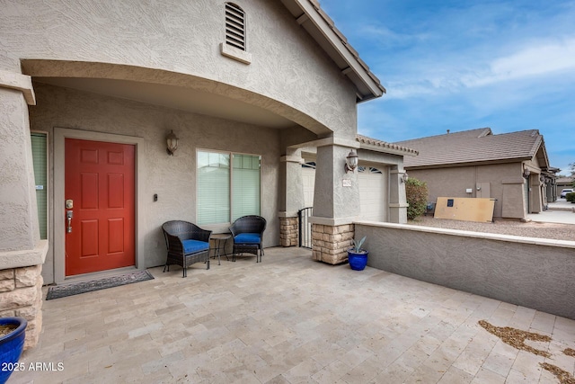 view of patio with a garage