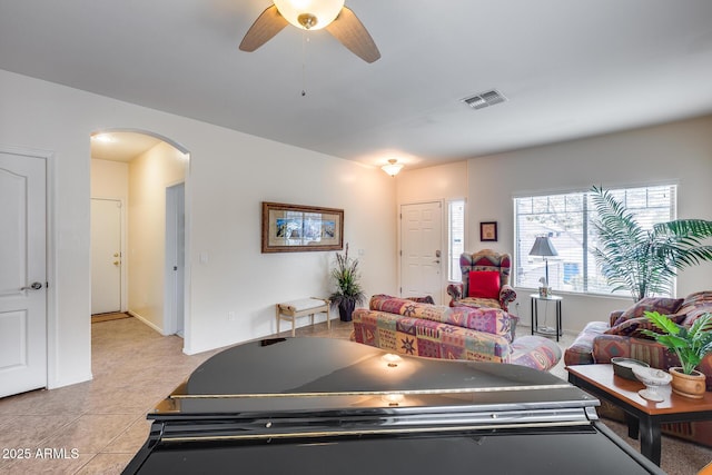 interior space featuring ceiling fan and light tile patterned flooring