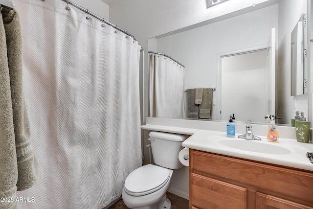 bathroom with vanity, toilet, and walk in shower