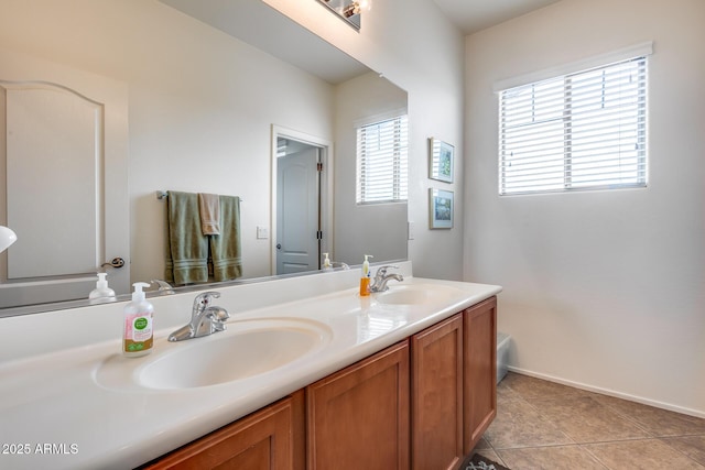 bathroom featuring tile patterned flooring and vanity