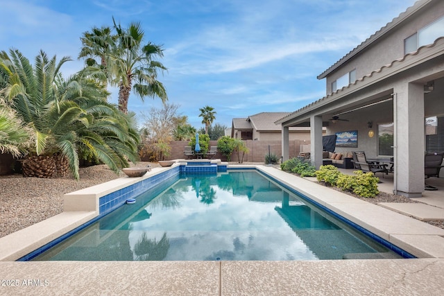 view of swimming pool with a patio area and ceiling fan