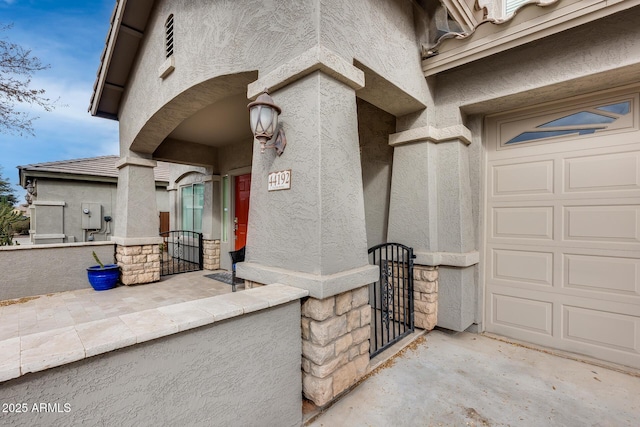 view of exterior entry featuring a garage