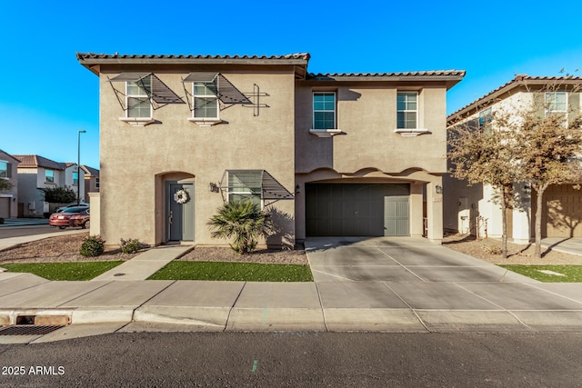 mediterranean / spanish-style home featuring a garage