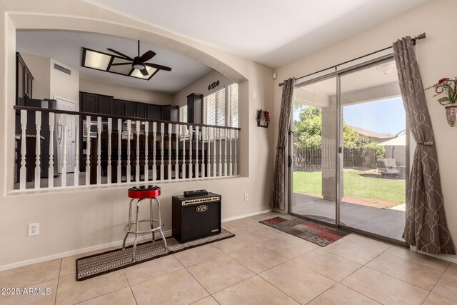 4834 E Robin Ln, Phoenix, AZ 85054 - doorway to outside featuring ceiling fan, baseboards, and tile patterned flooring