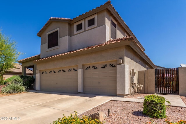 4834 E Robin Ln, Phoenix, AZ 85054 - mediterranean / spanish-style home with a garage, a tile roof, and stucco siding