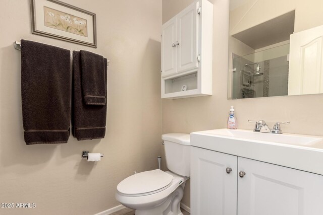 4834 E Robin Ln, Phoenix, AZ 85054 - bathroom featuring a shower stall, toilet, vanity, and baseboards